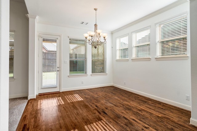 546 El Camino Dr, Frisco, TX 75036 - unfurnished dining area with crown molding, baseboards, dark wood-style floors, and a chandelier