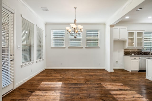 546 El Camino Dr, Frisco, TX 75036 - unfurnished dining area featuring ornamental molding, a chandelier, baseboards, dark wood-style flooring, and recessed lighting