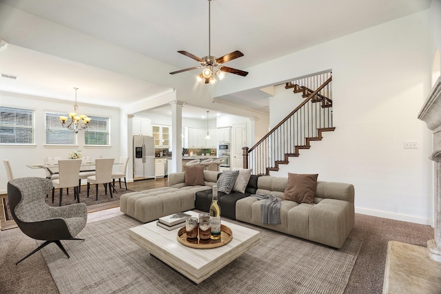 546 El Camino Dr, Frisco, TX 75036 - living room featuring baseboards, stairs, a ceiling fan, a chandelier, and carpet