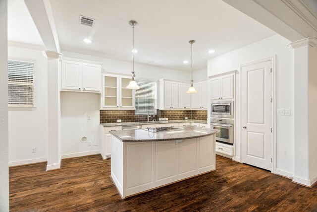 546 El Camino Dr, Frisco, TX 75036 - kitchen with stainless steel appliances, healthy amount of natural light, dark wood finished floors, and recessed lighting