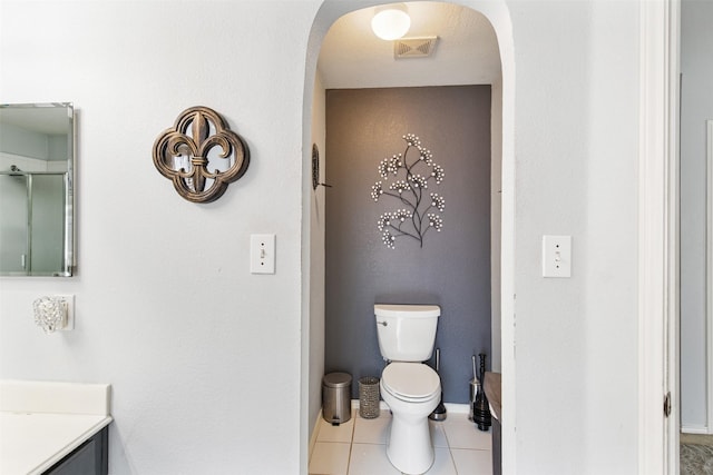 141 Buffalo Creek Dr, Desoto, TX 75115 - bathroom with vanity, toilet, tile patterned floors, a shower with door, and baseboards