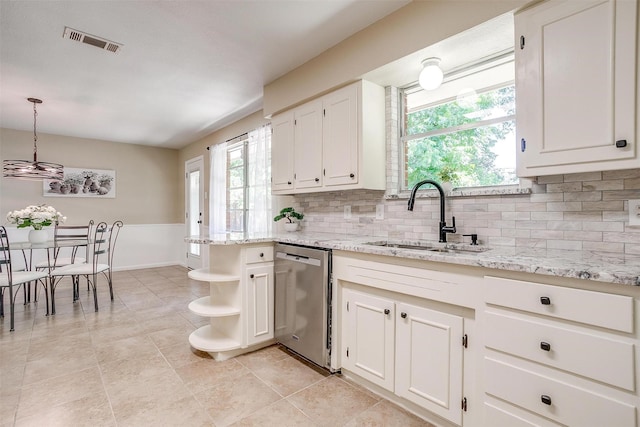 1309 Manor Dr, Cleburne, TX 76033 - kitchen featuring dishwasher, a sink, open shelves, white cabinets, and backsplash