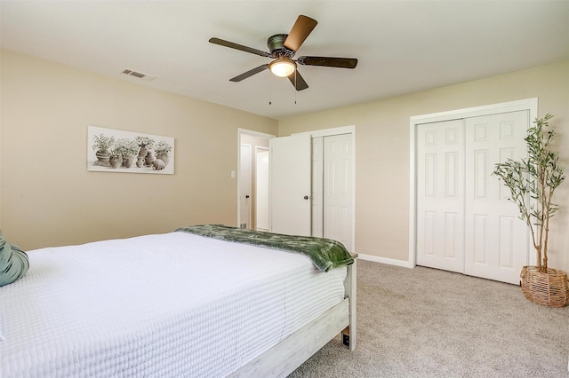 1309 Manor Dr, Cleburne, TX 76033 - bedroom featuring multiple closets, carpet flooring, baseboards, and ceiling fan