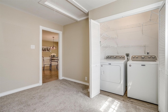 1309 Manor Dr, Cleburne, TX 76033 - laundry area with attic access, washer and clothes dryer, light colored carpet, and baseboards