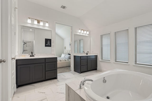 2316 Lazy Dog Ln, Northlake, TX 76247 - full bathroom featuring lofted ceiling, a garden tub, vanity, ensuite bath, and marble finish flooring