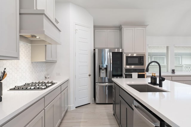 2316 Lazy Dog Ln, Northlake, TX 76247 - kitchen featuring stainless steel appliances, a sink, custom range hood, and light countertops