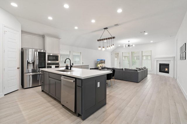 2316 Lazy Dog Ln, Northlake, TX 76247 - kitchen featuring appliances with stainless steel finishes, light wood finished floors, a sink, light countertops, and recessed lighting