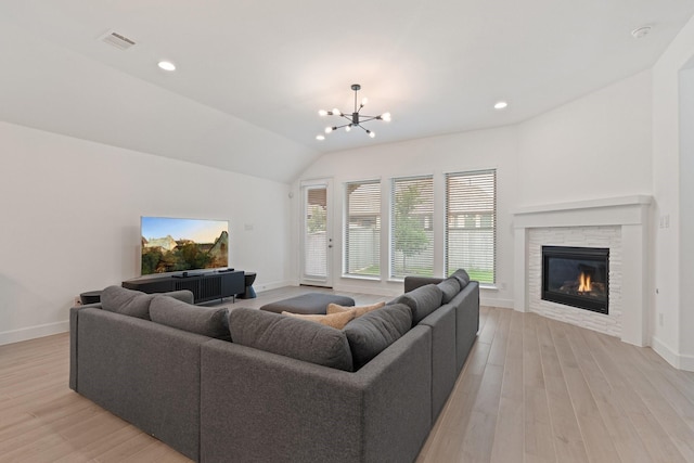 2316 Lazy Dog Ln, Northlake, TX 76247 - living area featuring baseboards, light wood finished floors, a stone fireplace, a chandelier, and recessed lighting