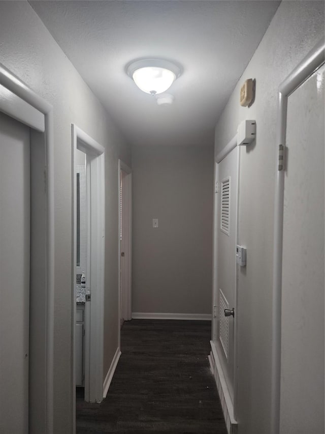 5209 Wharton Dr, Fort Worth, TX 76133 - corridor featuring dark wood-type flooring and baseboards
