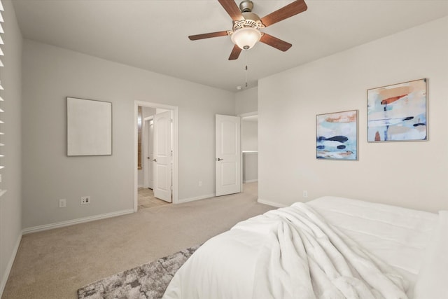 818 Birdie Dr, Allen, TX 75013 - bedroom with light carpet, baseboards, connected bathroom, and ceiling fan