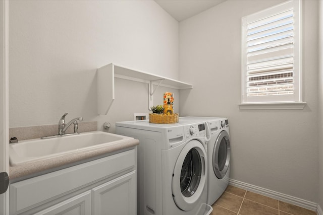 818 Birdie Dr, Allen, TX 75013 - washroom featuring washer and dryer, baseboards, light tile patterned flooring, and cabinet space