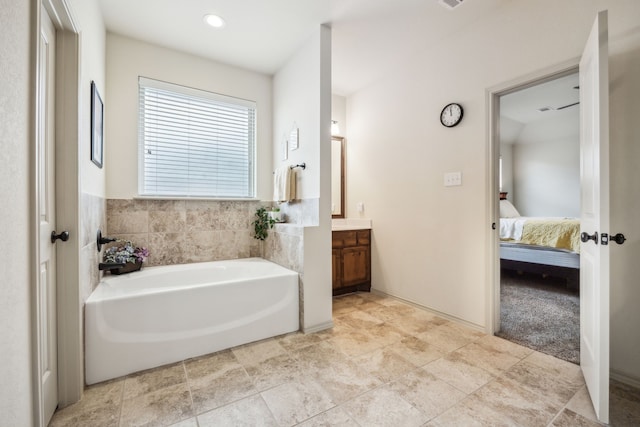 1685 Laramie Ln, Burleson, TX 76028 - ensuite bathroom with vanity, a bath, and recessed lighting