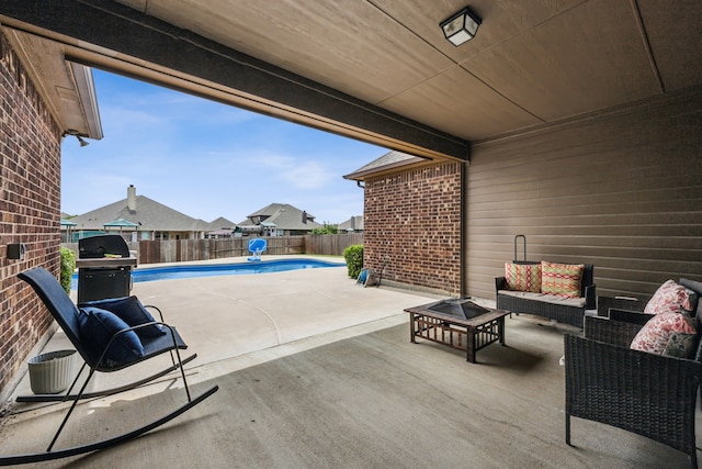 1685 Laramie Ln, Burleson, TX 76028 - fenced backyard with a patio area, a fire pit, and a grill