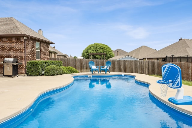 1685 Laramie Ln, Burleson, TX 76028 - view of swimming pool with grilling area, a fenced backyard, and a patio area
