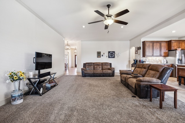 1685 Laramie Ln, Burleson, TX 76028 - living room featuring light carpet, ceiling fan, crown molding, arched walkways, and recessed lighting