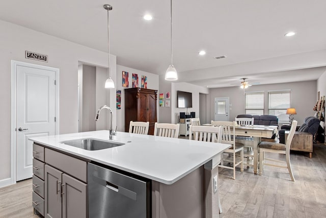 601 Big Horn Pass, Denton, TX 76210 - kitchen with a sink, dishwasher, light wood-style floors, gray cabinets, and a ceiling fan