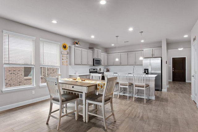 601 Big Horn Pass, Denton, TX 76210 - dining space featuring baseboards, light wood-style floors, and recessed lighting