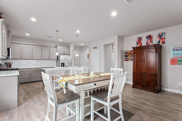 601 Big Horn Pass, Denton, TX 76210 - dining room with light wood-type flooring, baseboards, and recessed lighting