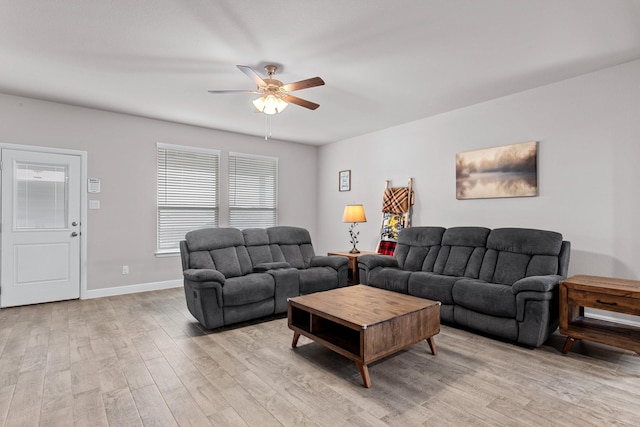 601 Big Horn Pass, Denton, TX 76210 - living room featuring a ceiling fan, light wood-style flooring, and baseboards