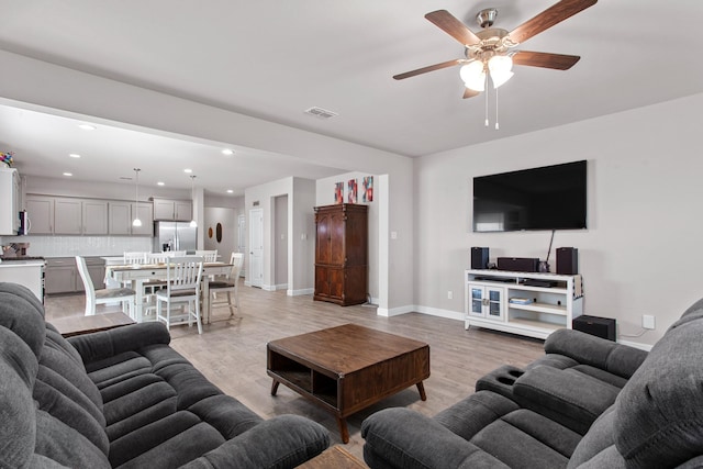 601 Big Horn Pass, Denton, TX 76210 - living area featuring light wood-style flooring, ceiling fan, baseboards, and recessed lighting