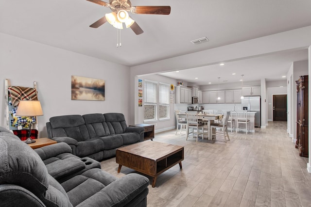 601 Big Horn Pass, Denton, TX 76210 - living room featuring light wood-style floors, a ceiling fan, baseboards, and recessed lighting