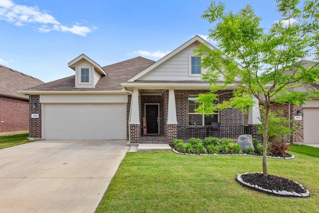 601 Big Horn Pass, Denton, TX 76210 - view of front facade with brick siding, a garage, a front yard, and driveway