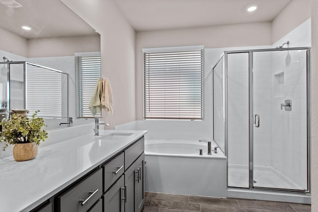 601 Big Horn Pass, Denton, TX 76210 - bathroom featuring vanity, a bath, a shower stall, and recessed lighting
