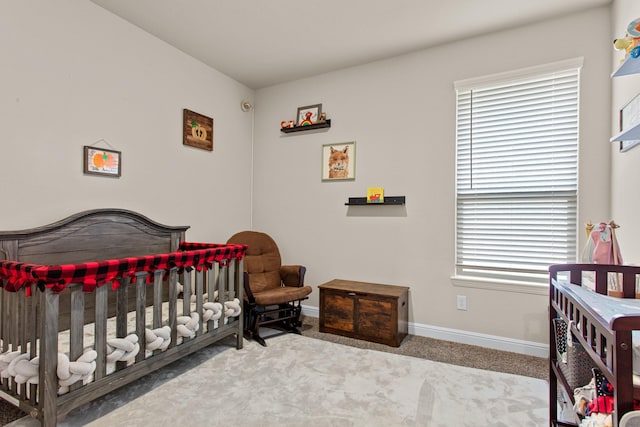 601 Big Horn Pass, Denton, TX 76210 - bedroom with baseboards, carpet, and a nursery area