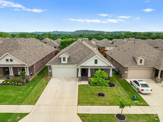 601 Big Horn Pass, Denton, TX 76210 - view of front of house with brick siding, concrete driveway, a front lawn, and a residential view
