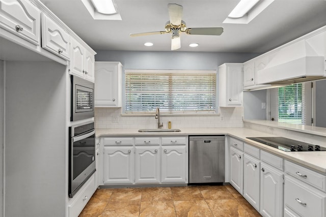 120 Royalwood Dr, Mabank, TX 75156 - kitchen with a sink, stainless steel appliances, ceiling fan, backsplash, and white cabinets