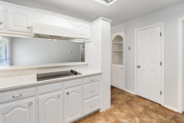 120 Royalwood Dr, Mabank, TX 75156 - kitchen with premium range hood, black electric cooktop, light countertops, and white cabinets