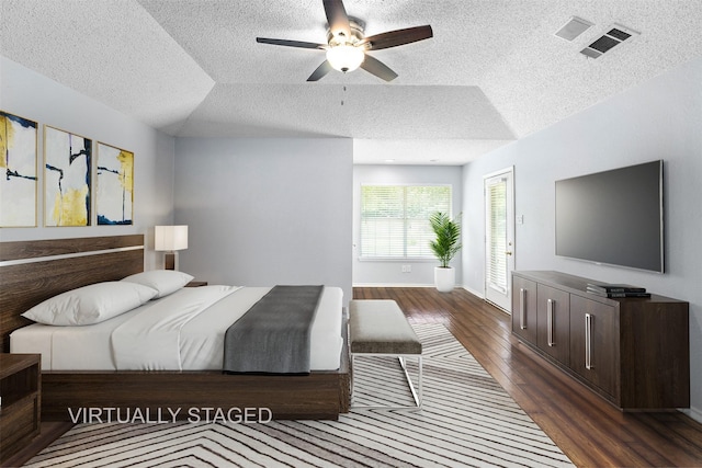 120 Royalwood Dr, Mabank, TX 75156 - bedroom with a textured ceiling, dark wood finished floors, a ceiling fan, and baseboards