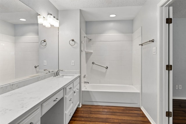 120 Royalwood Dr, Mabank, TX 75156 - full bathroom with wood finished floors, tub / shower combination, vanity, and a textured ceiling