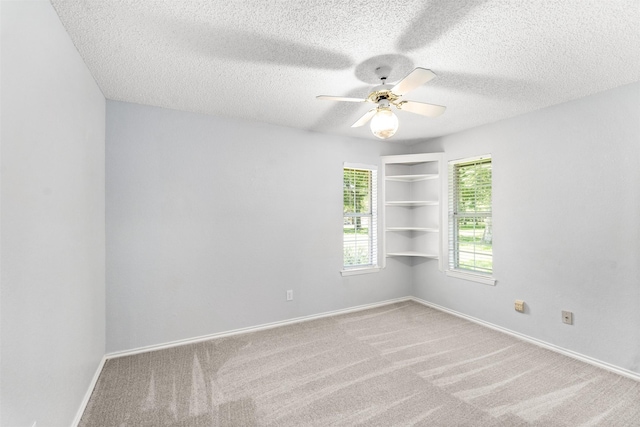 120 Royalwood Dr, Mabank, TX 75156 - spare room featuring carpet flooring, ceiling fan, a textured ceiling, and baseboards