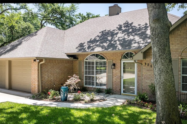 120 Royalwood Dr, Mabank, TX 75156 - view of front facade with a garage, a shingled roof, and brick siding