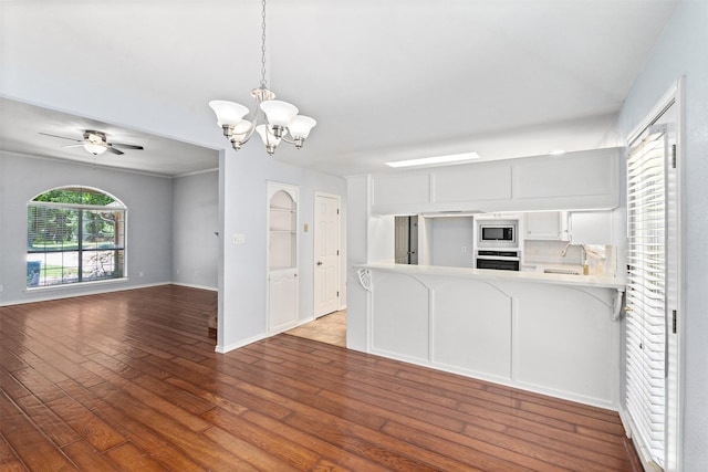 120 Royalwood Dr, Mabank, TX 75156 - kitchen with stainless steel appliances, wood-type flooring, light countertops, a chandelier, and a sink