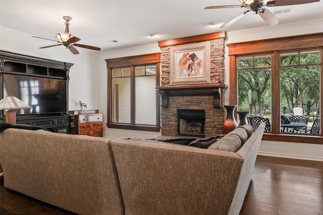 6815 Fm 1830, Argyle, TX 76226 - living room featuring ceiling fan, a fireplace, dark wood-style flooring, and ornamental molding