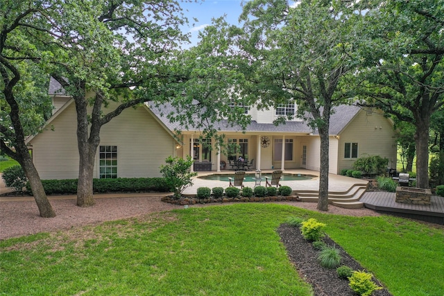 6815 Fm 1830, Argyle, TX 76226 - back of property with a yard, an outdoor pool, a deck, a shingled roof, and a patio