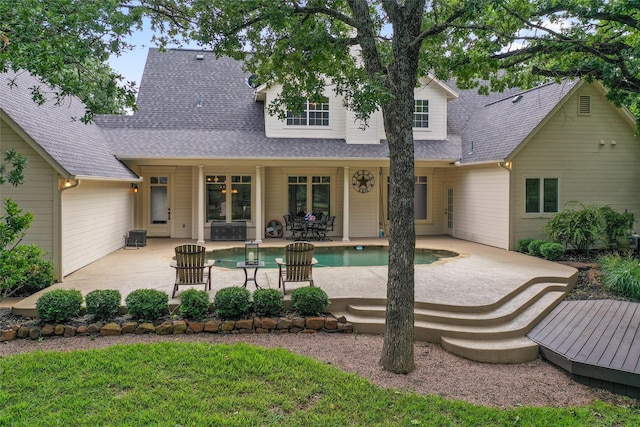 6815 Fm 1830, Argyle, TX 76226 - back of property featuring roof with shingles, an outdoor pool, and a patio