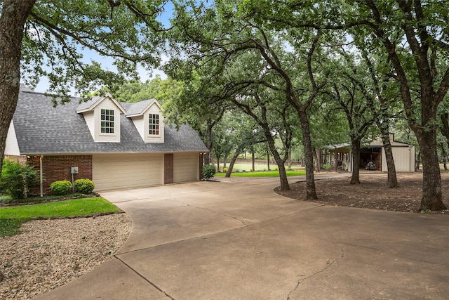 6815 Fm 1830, Argyle, TX 76226 - view of front of property with brick siding, concrete driveway, and a shingled roof