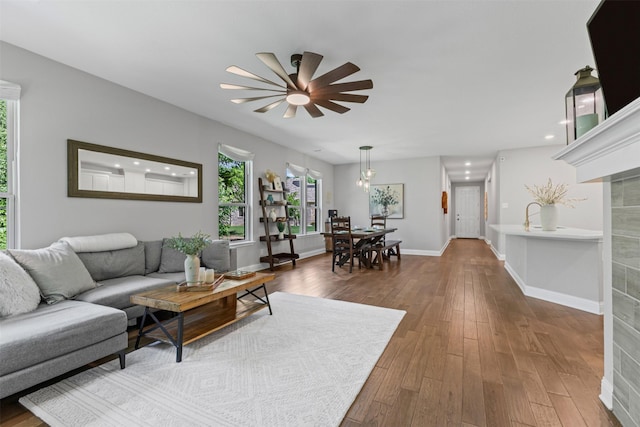 7885 Hickory Branch Dr, Frisco, TX 75034 - living area with a ceiling fan, wood finished floors, baseboards, and recessed lighting