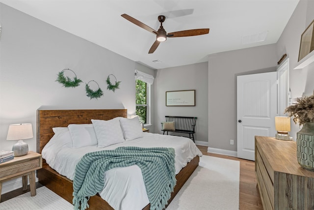 7885 Hickory Branch Dr, Frisco, TX 75034 - bedroom featuring baseboards, ceiling fan, and wood finished floors