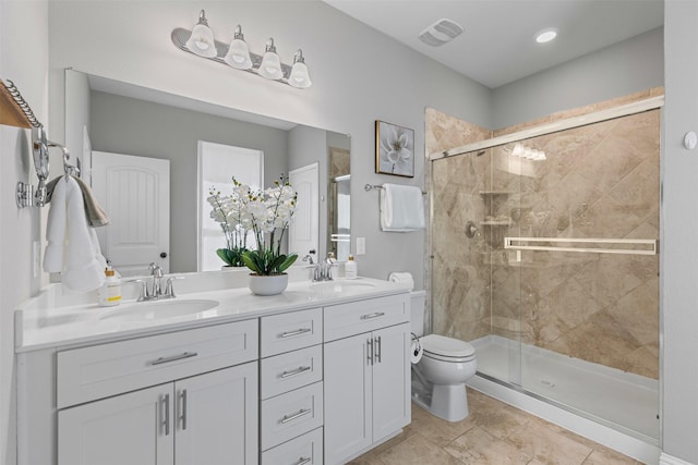 7885 Hickory Branch Dr, Frisco, TX 75034 - full bathroom with double vanity, a shower stall, and toilet