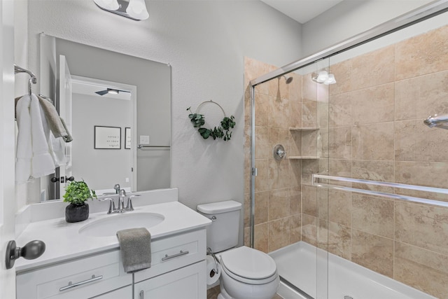 7885 Hickory Branch Dr, Frisco, TX 75034 - bathroom featuring a shower stall, vanity, and toilet