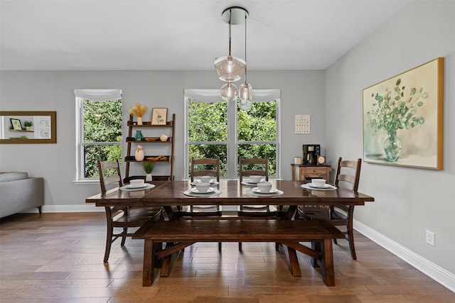 7885 Hickory Branch Dr, Frisco, TX 75034 - dining space with healthy amount of natural light, wood finished floors, and baseboards