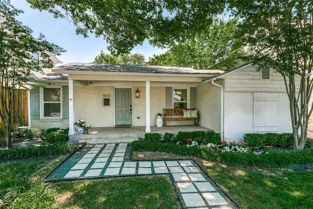 5022 W Hanover Ave, Dallas, TX 75209 - view of front facade with brick siding and covered porch