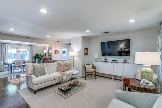 5022 W Hanover Ave, Dallas, TX 75209 - living room with crown molding, recessed lighting, and wood finished floors