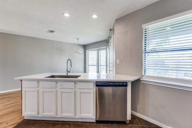 630 W Canty St Unit B6, Dallas, TX 75208 - kitchen featuring stainless steel dishwasher, a sink, white cabinets, baseboards, and recessed lighting