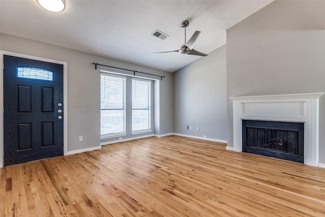 630 W Canty St Unit B6, Dallas, TX 75208 - unfurnished living room featuring vaulted ceiling, light wood finished floors, ceiling fan, a fireplace, and baseboards