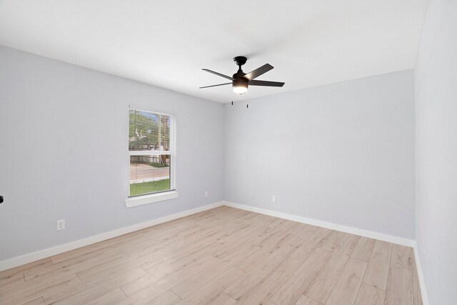 3812 Burton Ave, Fort Worth, TX 76105 - empty room with light wood-style floors, a ceiling fan, and baseboards